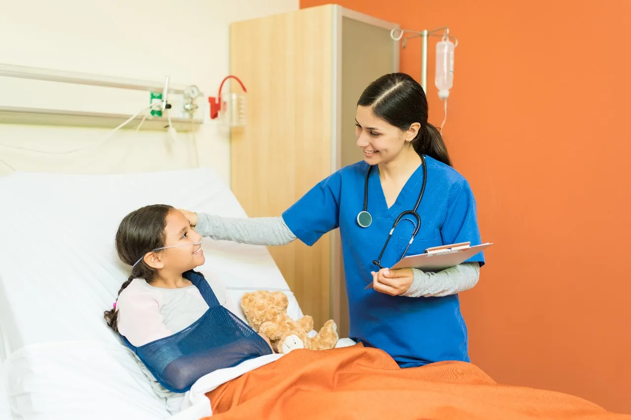 A nurse caring for a child in hospital