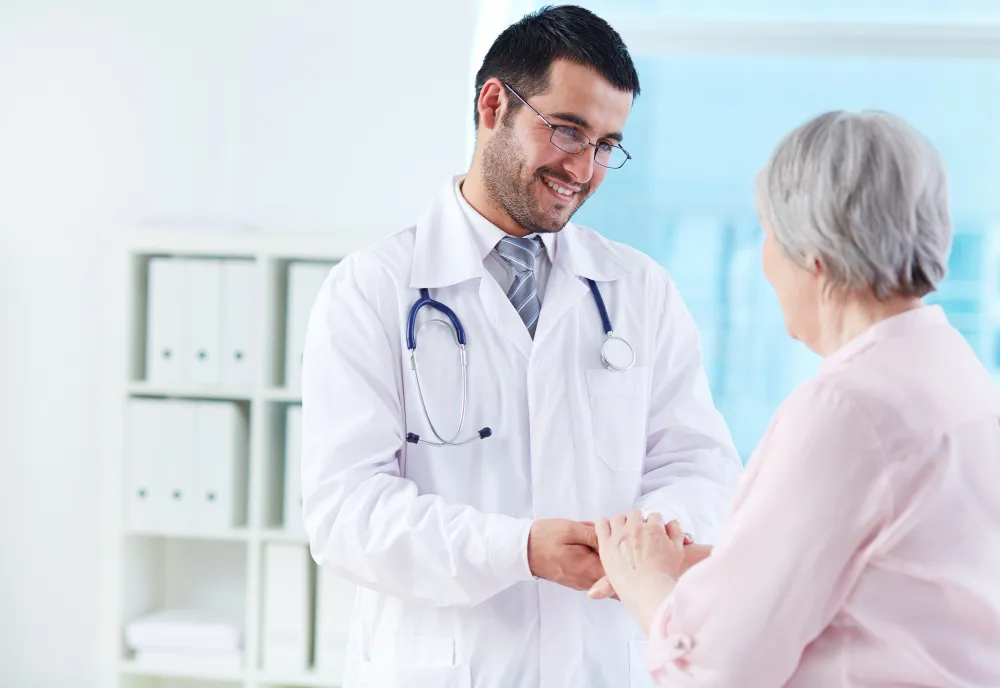A doctor consulting an elderly patient