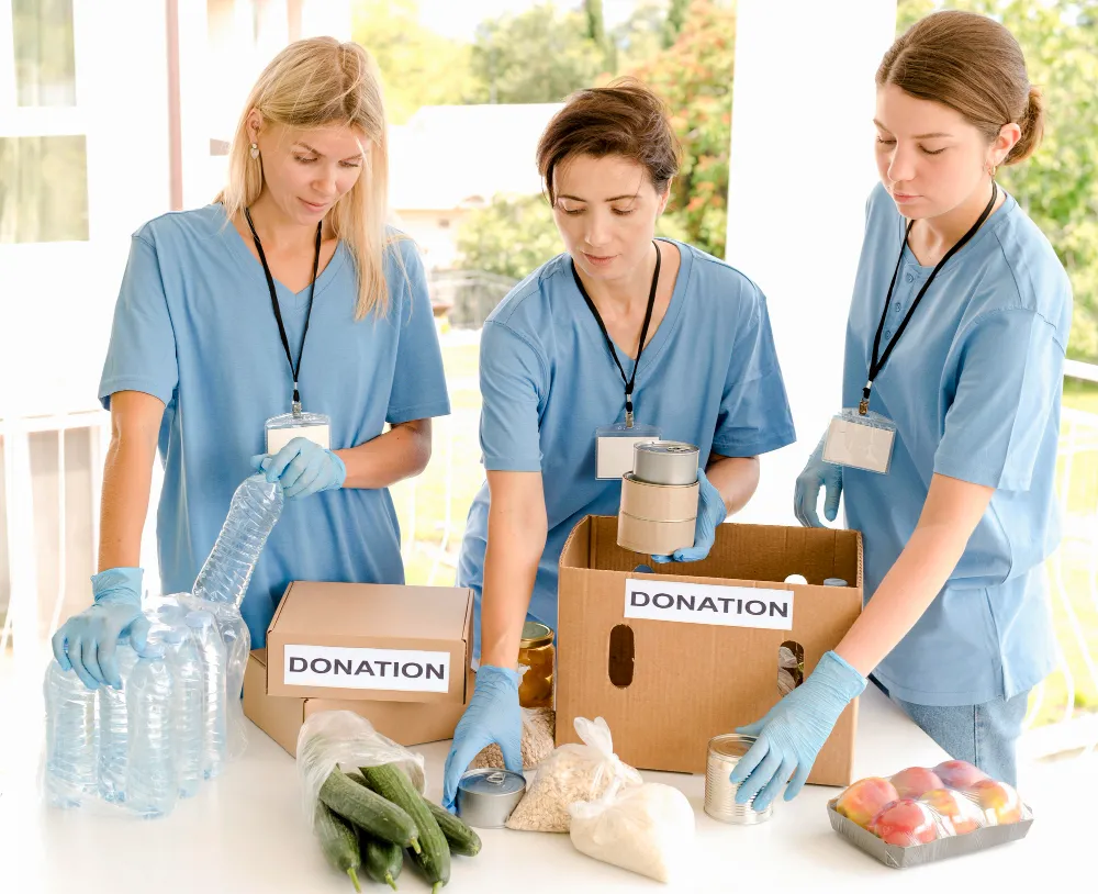 Volunteers packing donation boxes